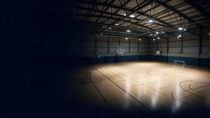 Visualisation illustrative d’un espace sportif intérieur éclairé.